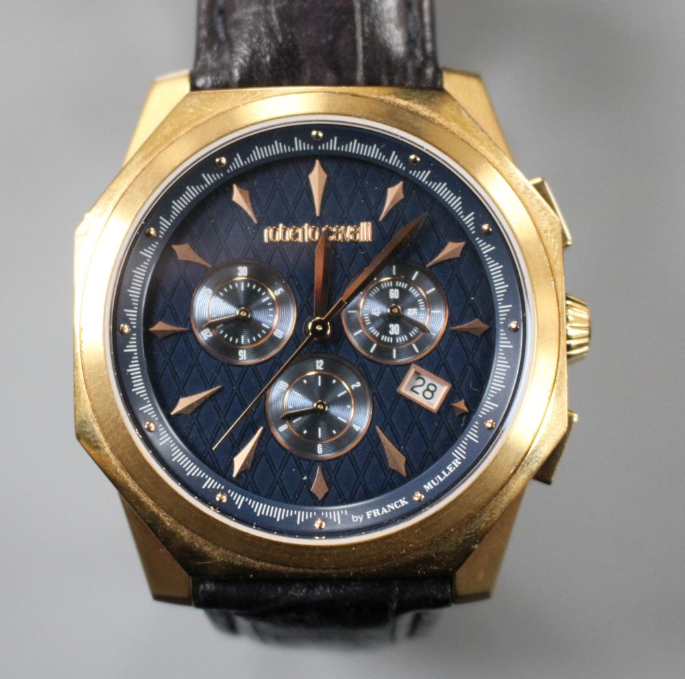 A gentlemans gilt steel Robert Cavalli quartz chronograph wrist watch, with box.